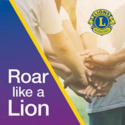 A group of people in a circle with camera focused on all hands in together.